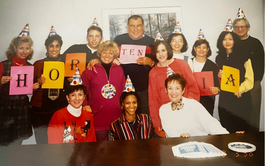 Early photo of Global LT team members celebrating Hortensia, the founder