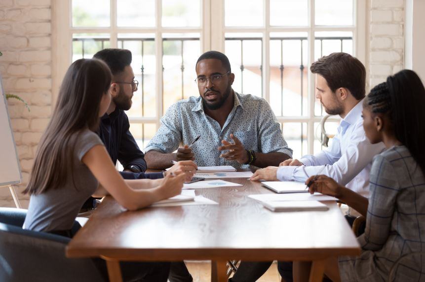 Bilingual university students discussing a group project in native and non-native languages